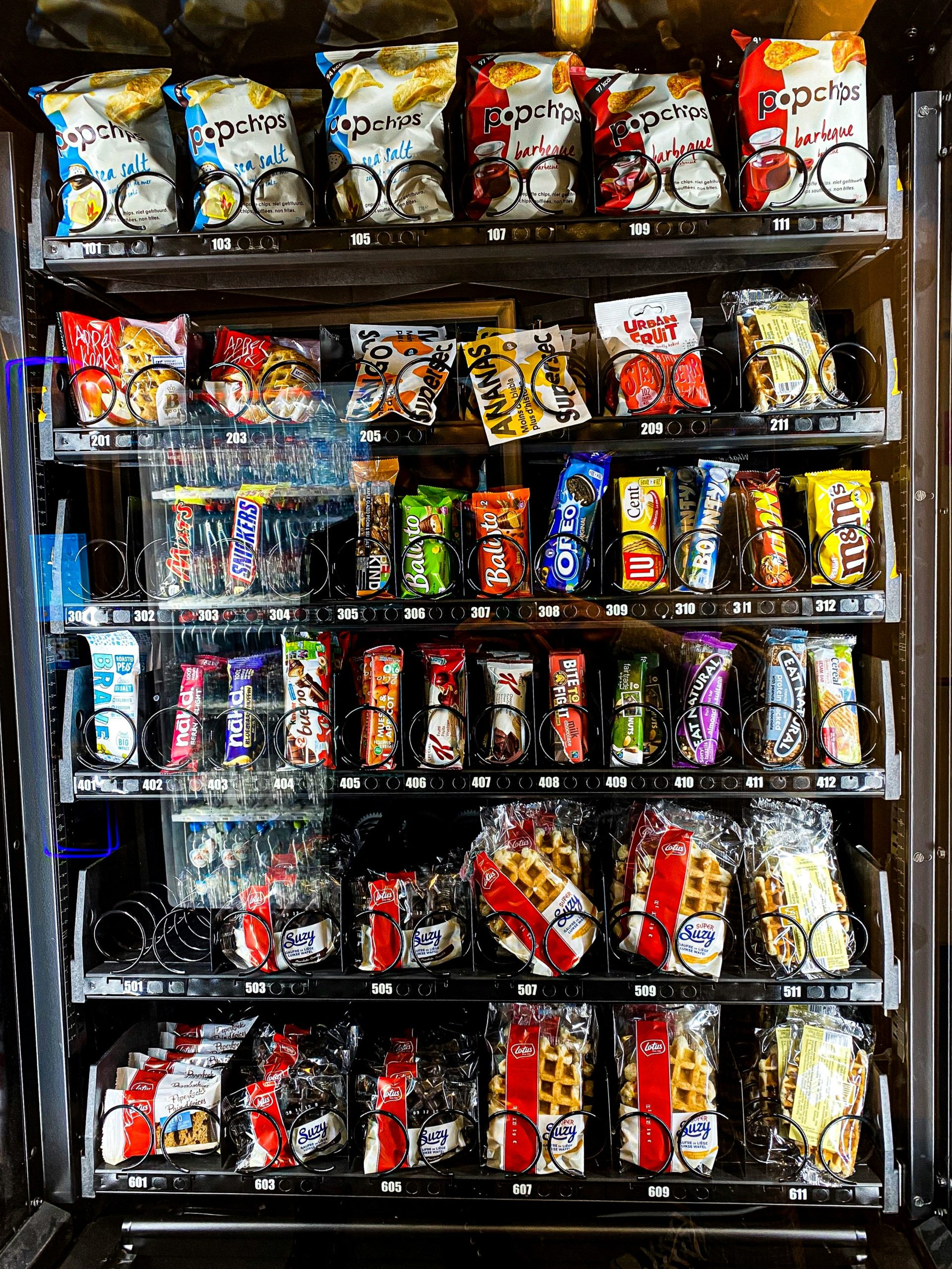 premium snack vending machine fully stocked with a wide variety of popular branded snacks