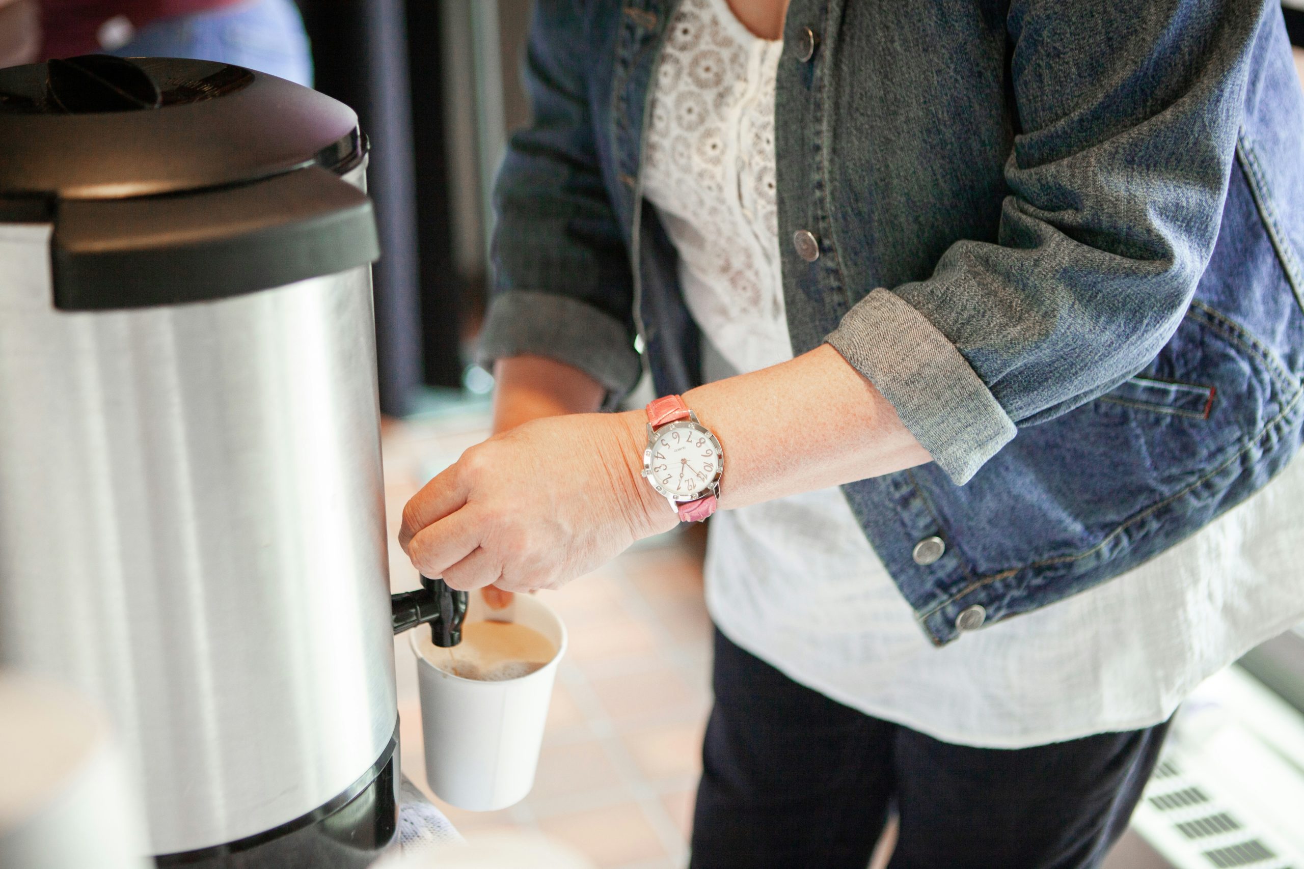 Professional bean-to-cup coffee machine providing fresh coffee in a modern commercial workplace.